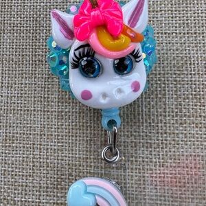 Unicorn badge reel with blue rhinestones